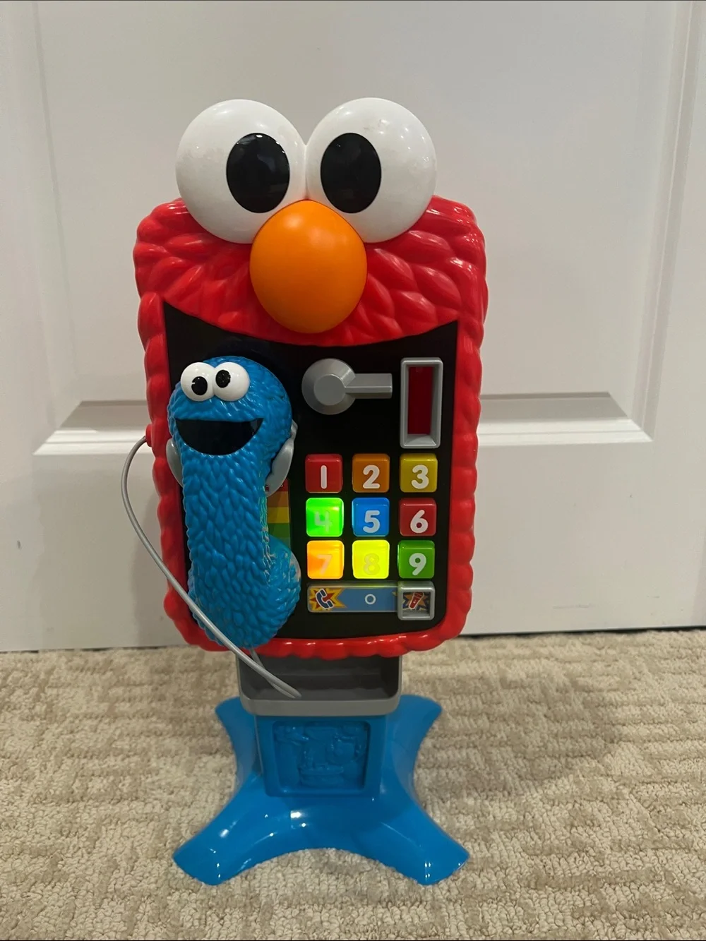 Sesame street Elmo Themed Light-Up Phone Toy with Cookie Monster Handset